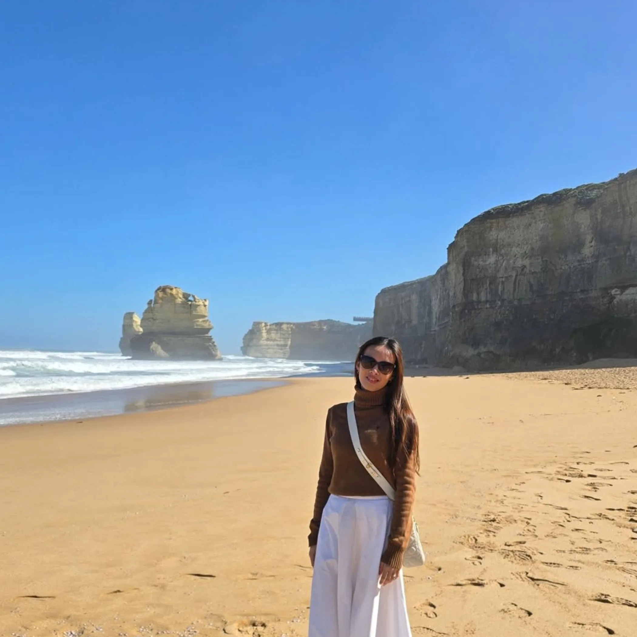 person on great ocean road beach winter clothing